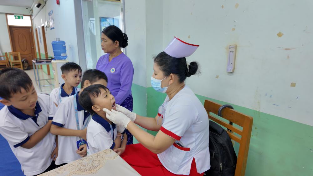 Students examining a globe