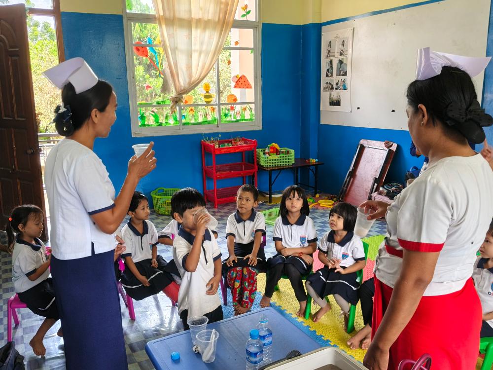 Students writing in notebooks